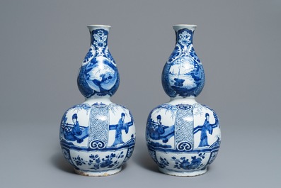 A pair of Dutch Delft blue and white double gourd chinoiserie vases, 18th C.